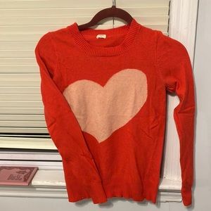 J crew sweater heart. It’s like a red orange with a cream heart